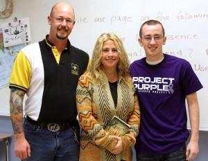 David Wright, Sr., English teacher Allie June and David Wright, Jr. pose for a picture following the elder Wright's presentation to June's class.