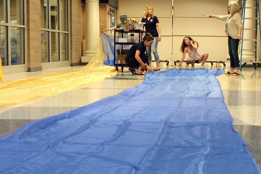 The Rotunda was alive with activity immediately after school Friday as students and teachers worked to set up for prom.