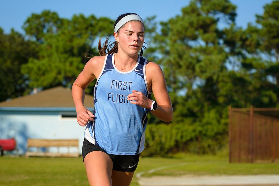 Senior Alex Rodman races to a first-place finish in a cross country meet earlier this year. PHOTO BY AARON JENNINGS/Shooters at the Beach/Special