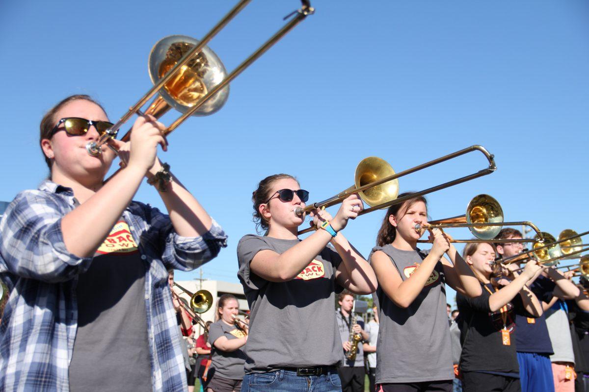 Trombone players (from left) Hopelyn Kovacs, Sloan Tomblin and Jill O'Dell practice Sunday morning at a high school in Tampa, Florida, in preparation for Monday's Outback Bowl performance. PHOTO BY STEVE HANF/Nighthawk News Magazine
