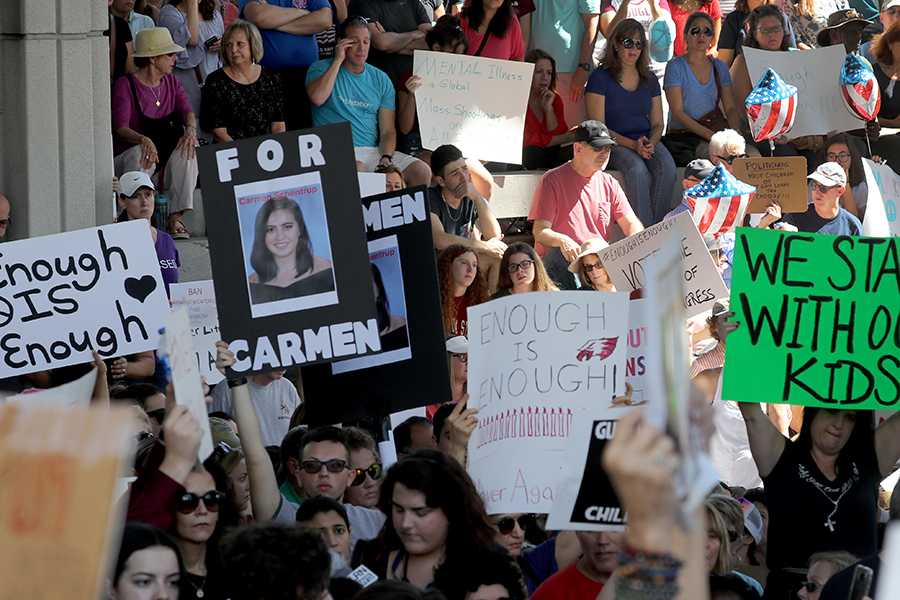 Protesters attend a rally at the Federal Courthouse in Fort Lauderdale, Fla., to demand government action on firearms. Their call to action last month is a response to the massacre at Marjory Stoneman Douglas High School in Parkland. FFHS students will participate in the national walkout on Wednesday. (Mike Stocker/Sun Sentinel/TNS)