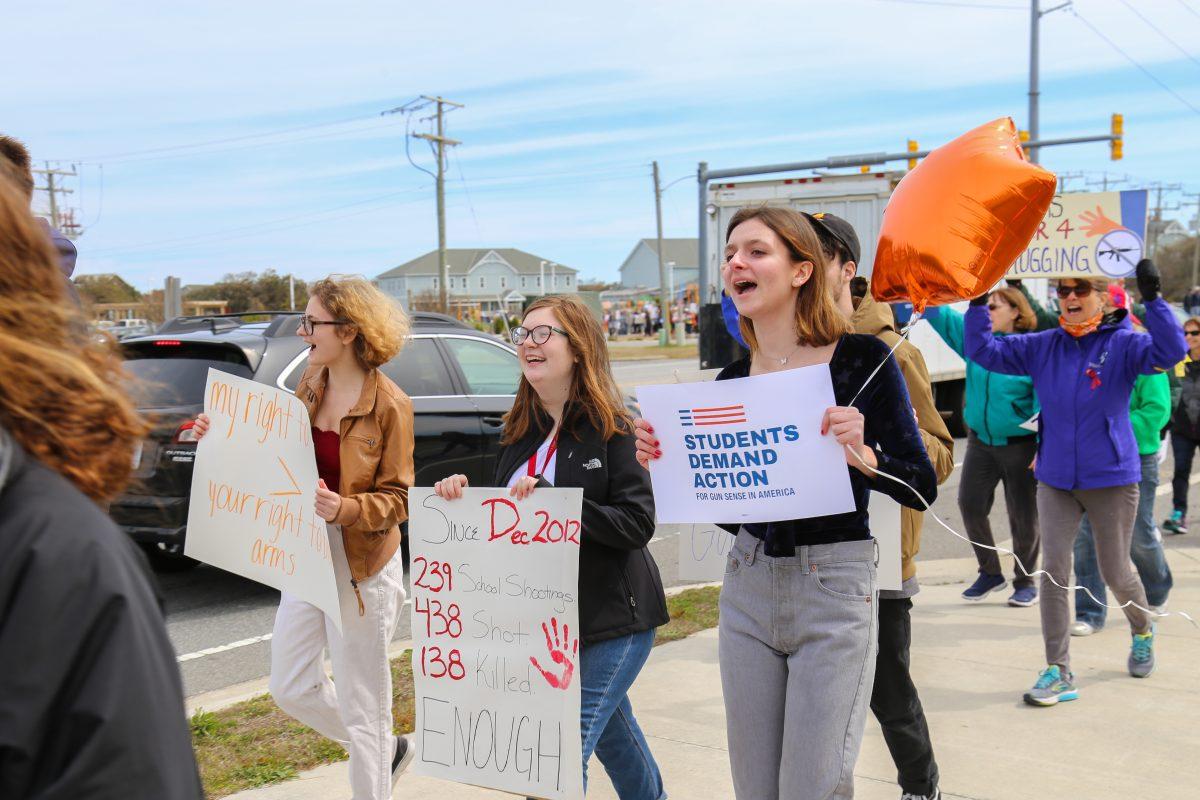 Caroline Jenkins (right) attends the March for our Lives event in Nags Head expressing her intention to become an informed voter in the wake of the Parkland tragedy. PHOTO BY BEN TRAN/Special to Nighthawk News