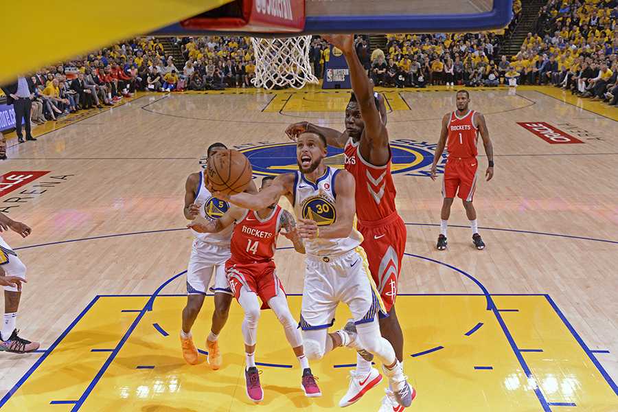 Stephen Curry (30) goes up for a layup past the Houston Rockets' Clint Capela (15) during the first quarter in Game 3 of the NBA Western Conference finals on Sunday, May 20, 2018 at Oracle Arena in Oakland, Calif. (Jose Carlos Fajardo/Bay Area News Group/TNS)