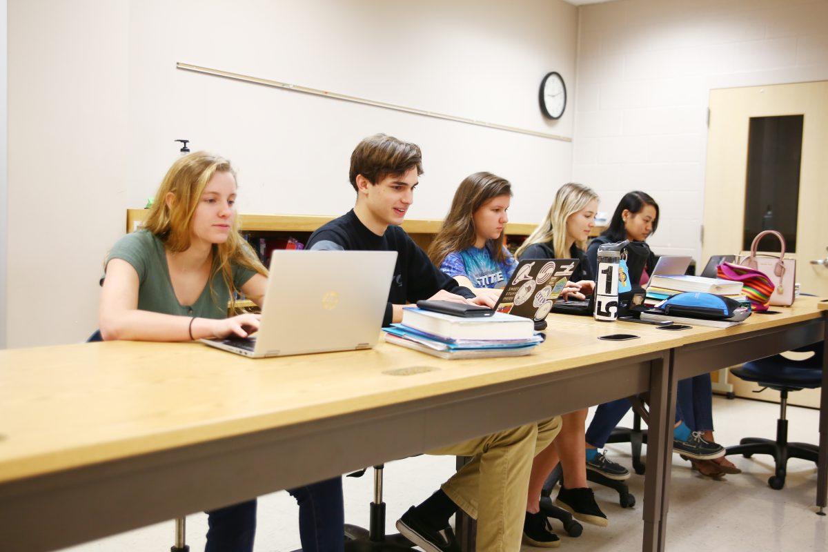 Students work diligently on classes in the online room, where they have the option of taking online courses from College of the Albemarle, NCVPS and Apex. Photo by Ben Tran/Nighthawk News