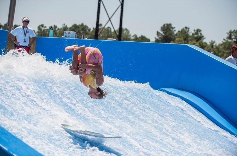Freshman Jackson Meyers performs a sick flip on the FlowRider at H2OBX. PHOTO SUBMITTED BY NICK BERNARD