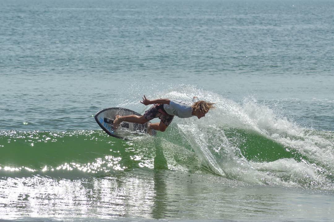 Senior Brady Green defies gravity on his skimboard in a pair of competitions last summer. Skimboarding has taken Green all over the East Coast and as far as Japan, and he recently turned pro in the sport. PHOTO COURTESY MAGGIE FERNANDEZ
