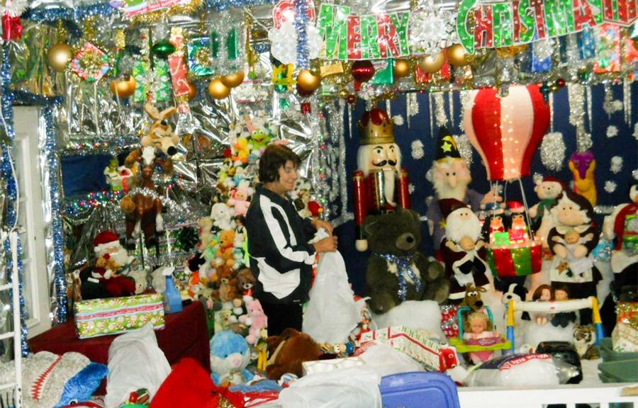 Ann Poulos works in the basement of the family's house to prepare the traditional Christmas display in this photo from 2011. PHOTO SUBMITTED BY DIANA MUELLER