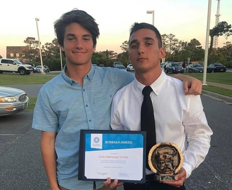 Cody Turbitt (right) stands with his brother Noah (left) after his graduation from BLET (Basic Law Enforcement Training).