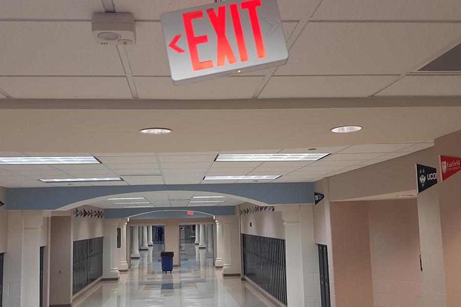 An EXIT sign hanging sideways after an attempt to steal the sign for a "devious lick". PHOTO BY MICHAEL PEARSON/Nighthawk News