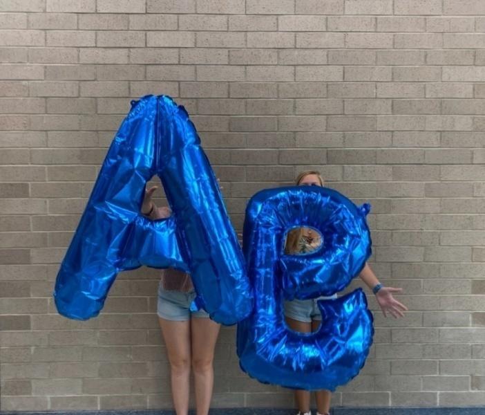 Senior Versailles Dalessio (on the left) and Kate Hamilton (on the right) showcase the new A/B ballons implemented for this year's new schedule.