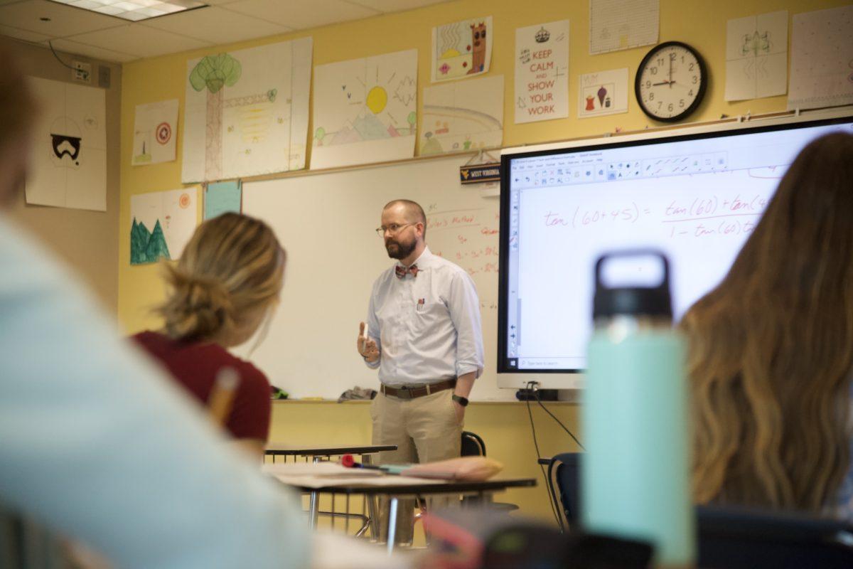 AP Calculus teacher Sam DeWitt is in the middle of instruction, prepaing students for the upcoming AP exam at the beginning of May.